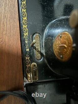 1934 singer sewing machine in wooden cabinet