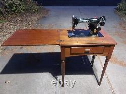 1949 Singer Sewing Machine Model 66 in cabinet, great shape