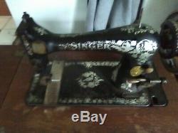 ANTIQUE SINGER SEWING MACHINE in Cabinet. With original assceories