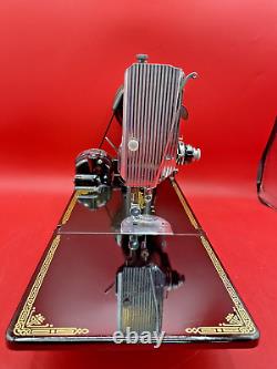 An Exceptionally Clean 1953 Singer Featherweight with a lot of accessories & case