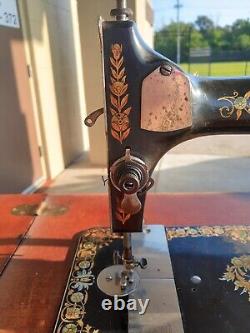 Antique 1901 Singer treadle sewing machine in cabinet, Attachments Included