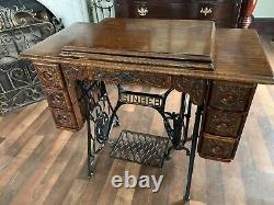 Antique (1906) singer ginger bread treadle sewing machine cabinet only