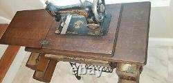 Antique 1910 Singer Sewing Machine with Oak Treadle Cabinet includes accessories