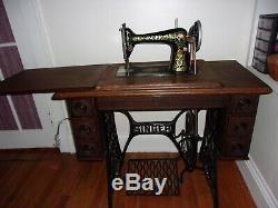 Antique 1913 Singer treadle sewing machine withOriginal Cabinet Red Eye Model 66-1