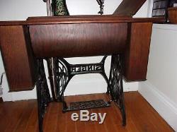 Antique 1913 Singer treadle sewing machine withOriginal Cabinet Red Eye Model 66-1