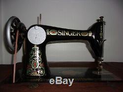 Antique 1913 Singer treadle sewing machine withOriginal Cabinet Red Eye Model 66-1