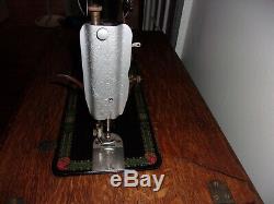 Antique 1913 Singer treadle sewing machine withOriginal Cabinet Red Eye Model 66-1