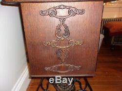 Antique 1913 Singer treadle sewing machine withOriginal Cabinet Red Eye Model 66-1