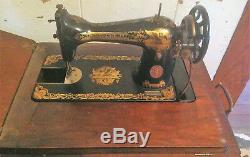 Antique 1925 Cast Iron Treadle Base Singer Sewing Machine in Oak Cabinet