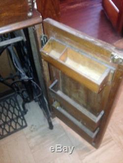 Antique 1925 Cast Iron Treadle Base Singer Sewing Machine in Oak Cabinet