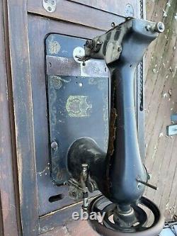 Antique King sewing machine in cabinet, vintage early 1900s