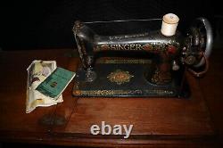 Antique Singer Red Eye No. 66 sewing machine in original cabinet