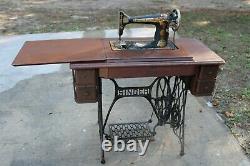 Antique Singer Sewing Machine In Treadle Oak Cabinet
