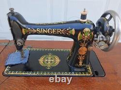 Antique Singer Sewing Machine Lotus Decals in a seven drawers cabinet, working