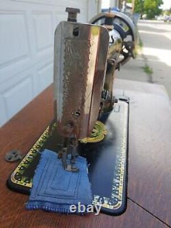 Antique Singer Sewing Machine Lotus Decals in a seven drawers cabinet, working