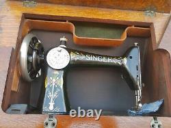 Antique Singer Sewing Machine Lotus Decals in a seven drawers cabinet, working