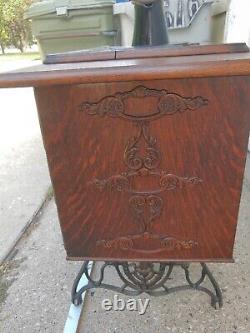 Antique Singer Sewing Machine Lotus Decals in a seven drawers cabinet, working