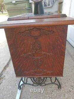 Antique Singer Sewing Machine Lotus Decals in a seven drawers cabinet, working