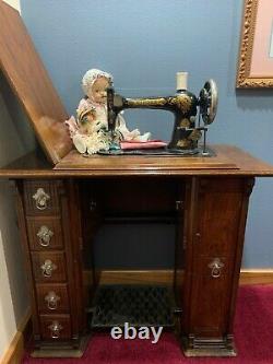 Antique Singer Sewing Machine, with cabinet and treadle