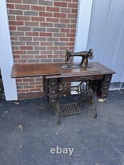 Antique Singer Sewing Treadle Machine with 7 Drawer Cabinet