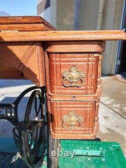 Antique Singer five drawer Sewing Machine Cabinet, tested, working, attachments
