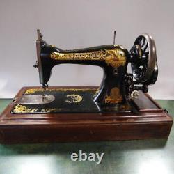 Antique Singer hand-cranked sewing machine sphinx design