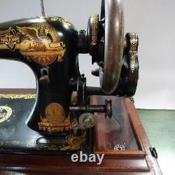 Antique Singer hand-cranked sewing machine sphinx design