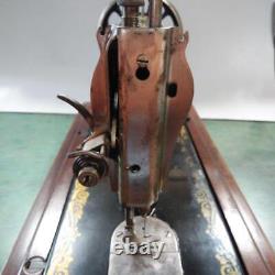 Antique Singer hand-cranked sewing machine sphinx design