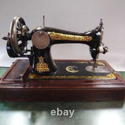 Antique Singer hand-cranked sewing machine sphinx design