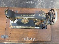 Antique Singer sewing machine and desk. G series serial number G0795029