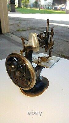 Antique childs hand crank singer sewing machine