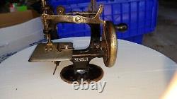 Antique childs hand crank singer sewing machine