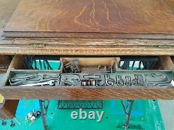 Antique early 1900's Singer Sewing Machine Lotus treadle cabinet withattachments