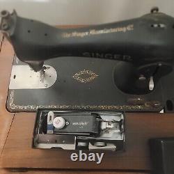 Antique singer sewing machine in cabinet