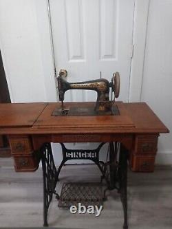 Antique singer sewing machine no. 27 with instructions