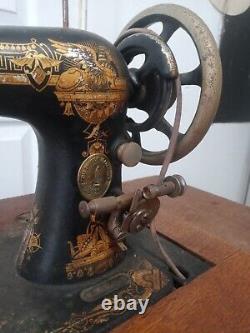 Antique singer sewing machine no. 27 with instructions