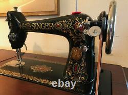 Antique singer sewing machine red eye