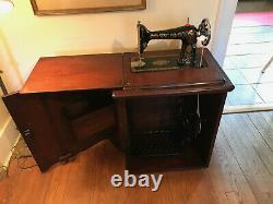 Antique singer sewing machine red eye