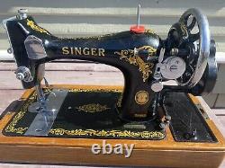 Antique vintage Singer 128K sewing machine with wooden base