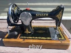 Antique vintage Singer 128K sewing machine with wooden base