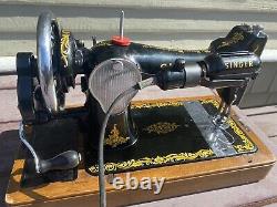 Antique vintage Singer 128K sewing machine with wooden base