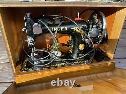 Antique vintage Singer 128K sewing machine with wooden base