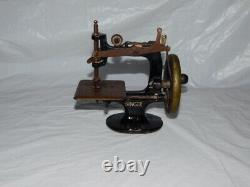 Antique vintage Singer sewing machine salesman sample miniature toy cast metal