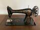 Antique1910 Singer Sewing Machine Withaccessories And 6-drawer Treadle Cabinet