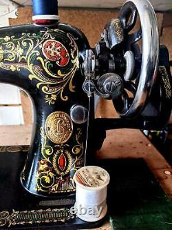 Astounding Antique Singer model 66 Red Eye sewing machine, back clamp atchm, 1915