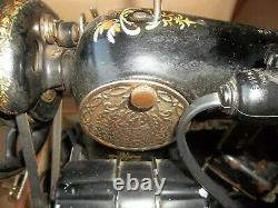 Singer sewing machine -1917 Red Eye Treadle Sewing Machine Model 66
