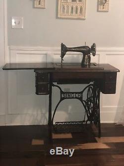 Singer vintage antique sewing machine in table cabinet