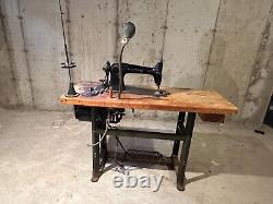 Two Antique Commercial Singer Sewing Machines with Table