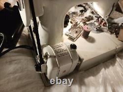 Vintage Singer Sewing Machine withcase, attachments & accessories. 110-120 volt