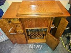 Vintage Singer Treadle sewing machine in cabinet